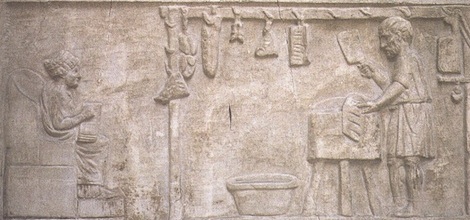 Carved butchers' shop scene with butcher and wife